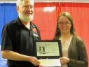 ARRL Southeastern Division Director Greg Sarratt, W4OZK, presents Hiram Percy Maxim Memorial Award recipient with a plaque and check. [Courtesy of Greg Sarratt, W4OZK]